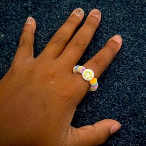 Ring with smiley face.